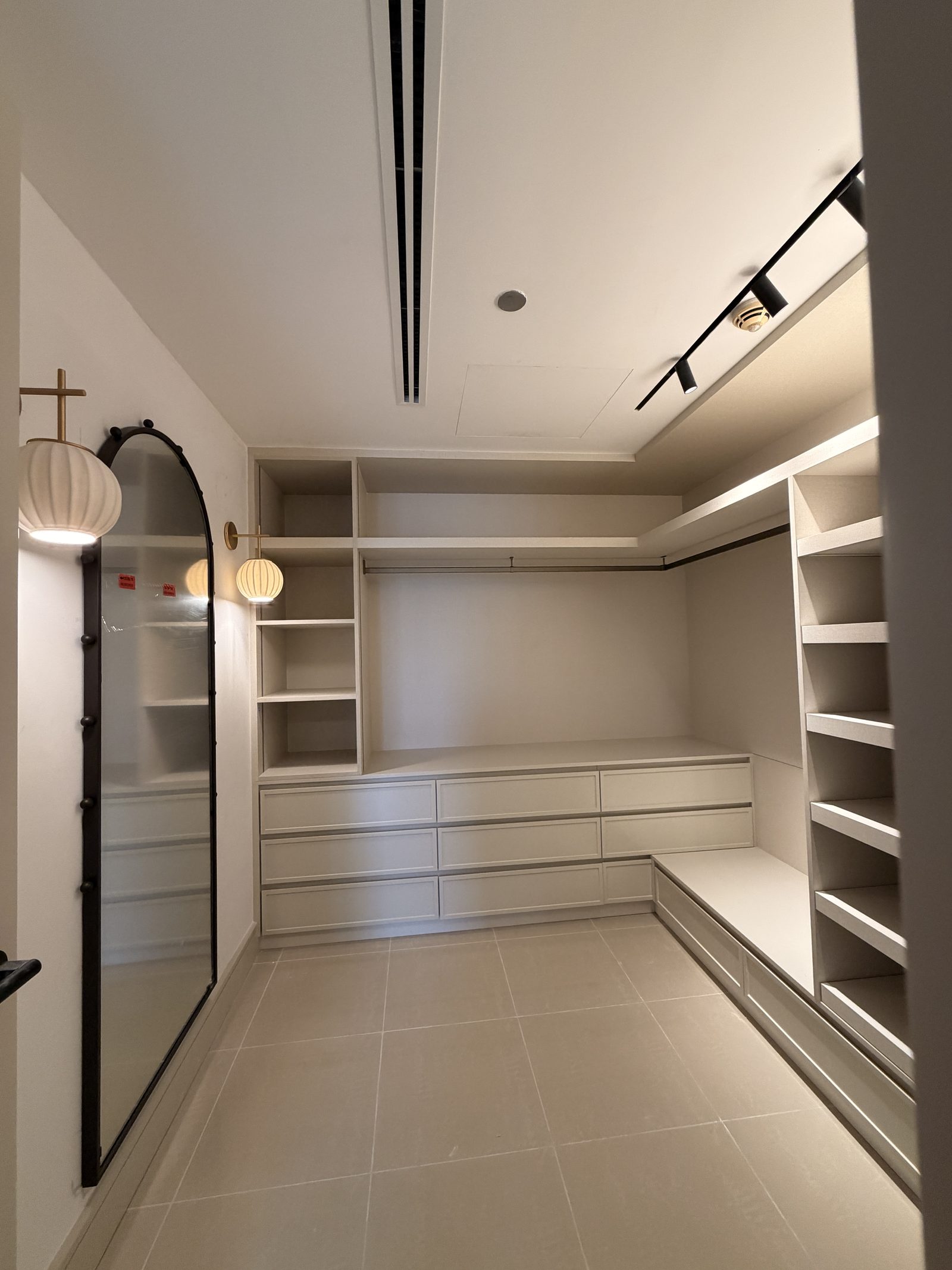Dressing room with lit shelving
